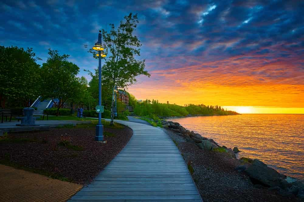 The lake next to the park at sunset